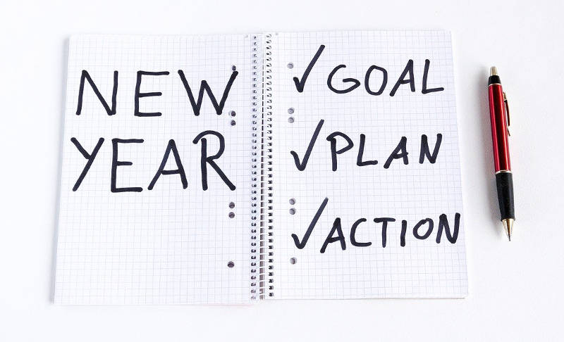 spiral notebook showing new year goals